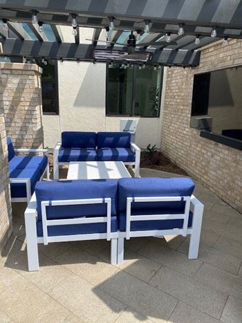 A group of blue and white chairs on a patio